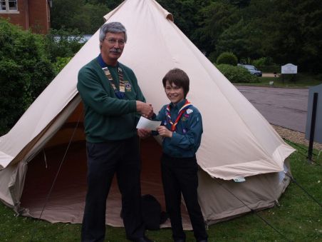 Lions President, Mick Claxton,  handing over the cheque