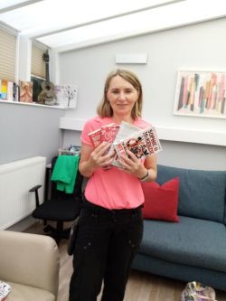The centre manager with a few of the books donated
