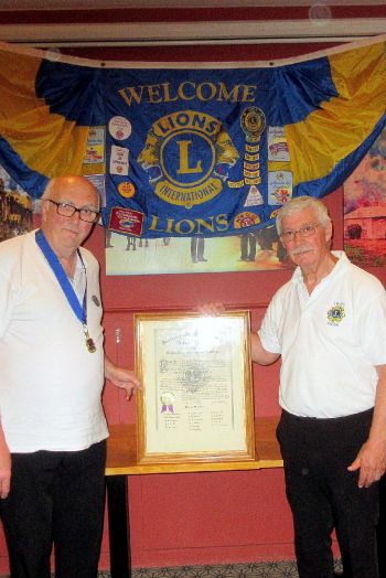 the outgoing president, Mick, hands over to the new president Martin