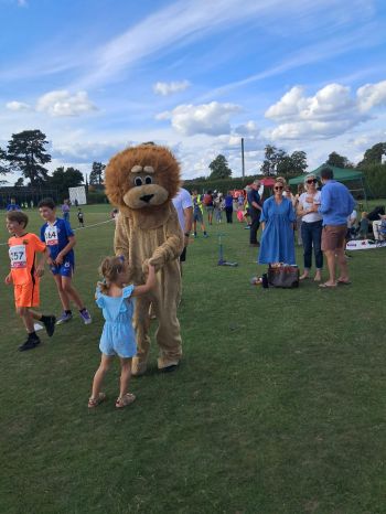 a dancing lion with young teacher